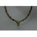 Gold adornments, bullhead pendant on a necklace